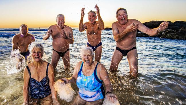 Currumbin Dingos Andy Reynolds, David Neumann, Siegi Huettner, Kaye Power, Ian Aitken and Terry O’Connell go for a sunrise dip. Picture: Nigel Hallett