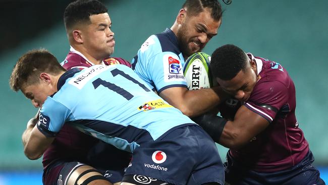 SYDNEY, AUSTRALIA - AUGUST 08: Karmichael HuntÃÂ of the Waratahs is tackled during the round six Super Rugby AU match between the Waratahs and the Reds at Sydney Cricket Ground on August 08, 2020 in Sydney, Australia. (Photo by Cameron Spencer/Getty Images)