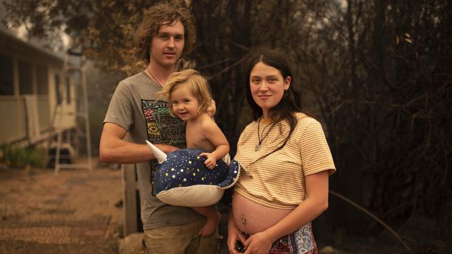 . Zoey Salucci-McDermott in Cobargo NSW, with her partner Michael and their daughter Uma. Picture: Sean Davey