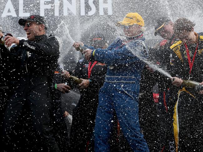 Champagne spray by the winners. Finish of Targa Tasmania 2019 at Macquarie Wharf shed no. 2. Picture: NIKKI DAVIS-JONES