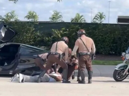 Footage that appears to show Tyreek Hill being arrested.