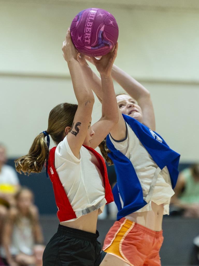 Lucy Tickell (left) and Greer Goodger during Toowoomba Netball Association junior representative trials at Clive Berghofer Arena, St Mary's College, Sunday, October 23, 2022. Picture: Kevin Farmer