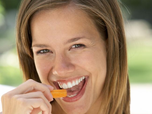 Get some carrot sticks into you, like this overly enthusiastic lady.