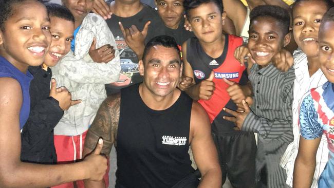 James Storer catches up with some happy Fijians to whom he donated footy boots and other equipment.