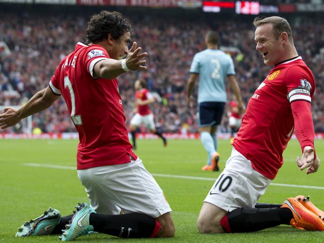 Wayne Rooney celebrates United’s opener with Rafael.