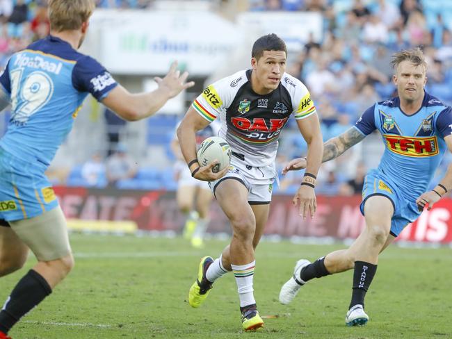 Dallin Watene-Zelezniak of the Panthers (centre) runs with the ball during the Round 22 NRL match between the Gold Coast Titans and the Penrith Panthers at Cbus Super Stadium on the Gold Coast, Saturday, August 11, 2018. Picture: AAP Image/Glenn Hunt