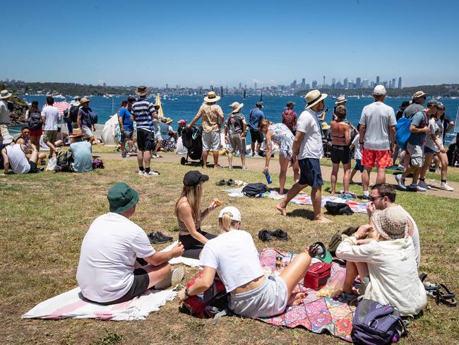 Spectators picnic near Hornby Light Keepers Cottage. Picture: Julian Andrews