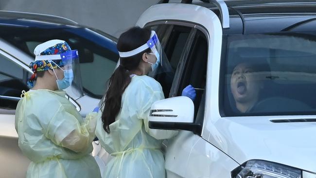 NSW Health workers conduct COVID-19 tests at a drive-through testing clinic in Sydney. Picture: NCA NewsWire/Steven Saphore