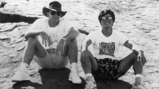 Nicknamed the Postcard Bandit, Brenden Abbott (left) - pictured with a tourist at Uluru - was rumoured to have sent postcards to police of his whereabouts as a means of taunting them while on the run. This claim was later debunked by his lawyer.