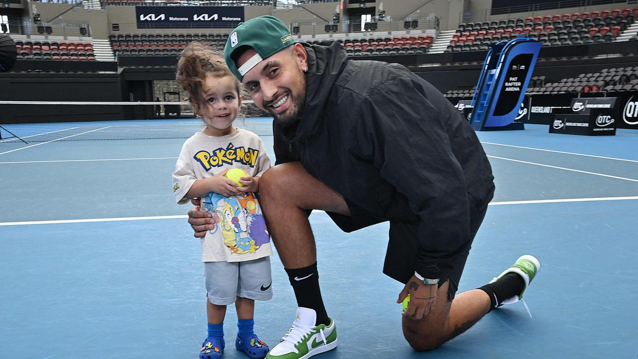 Kyrgios with 2yo nephew George announcing he’d be playing at the Brisbane International. Photo: Lyndon Mechielsen/Courier Mail