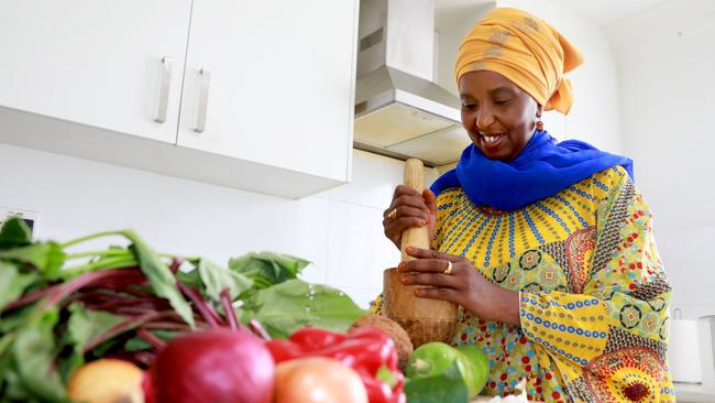 Saada Abdikarim works in her kitchen preparing a traditional Somali fried rice dish. Granville, Thursday, February 21st 2019. Africultures, the festival celebrating African cultures . One of the interesting parts of the festival is their food stallholders. (AAP IMAGE/ Angelo Velardo)