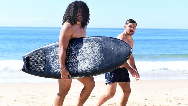 Konrad Hurrell is seen during the Gold Coast Titans beach swim at Kurrawa Beach. Photo: AAP