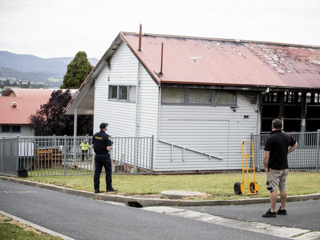 Police and fire investigators at the site of the overnight fire at Cosgrove High School. Picture: RICHARD JUPE