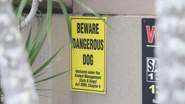 Photo of a declared dangerous dog sign. Photo by Richard Gosling