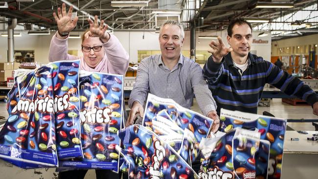 Bedford employees Lauren Packham and Cameron Richards with Gregg Harris, from NAB, packing showbags ahead of last year’s Royal Adelaide Show. Picture: AAP/MIKE BURTON