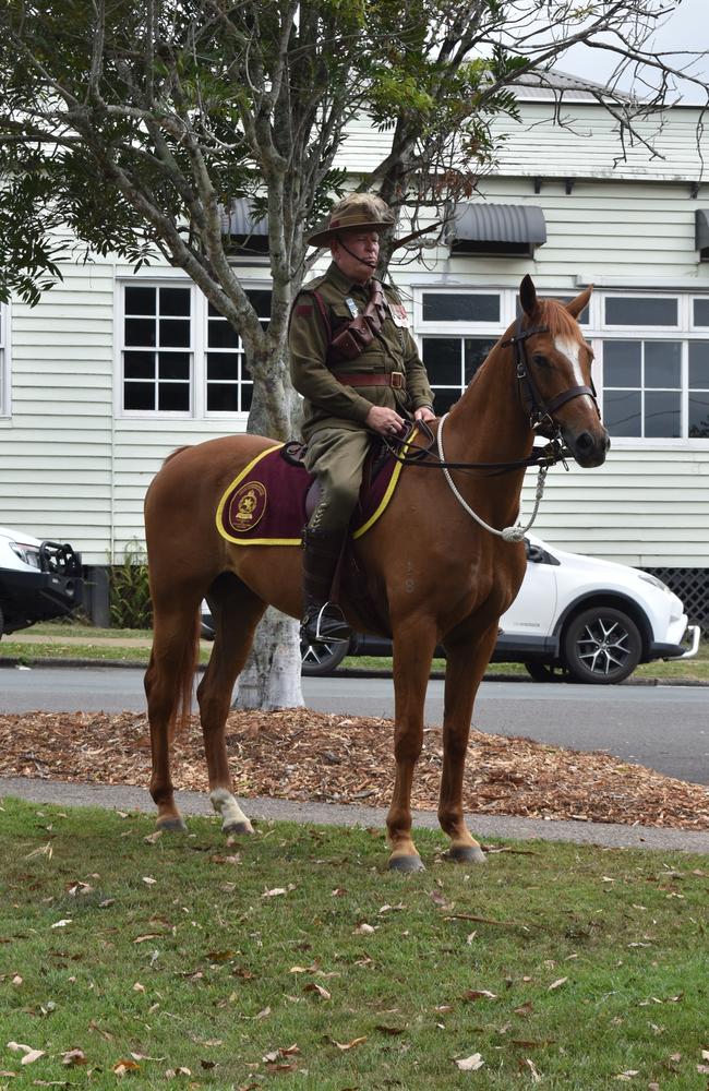 A horse and their rider stood at attention at Yandina.