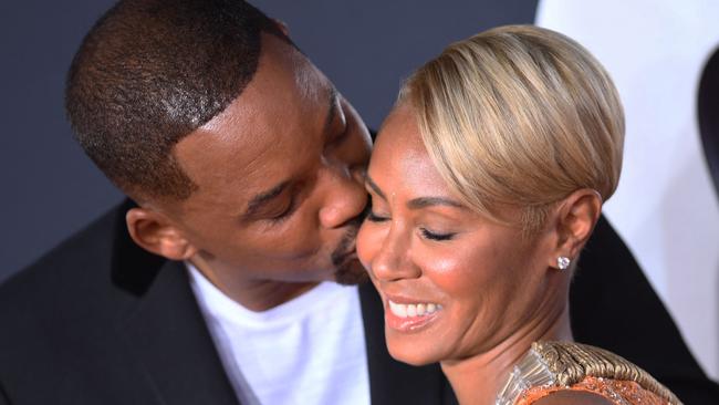 Will and Jada share a kiss on a red carpet. Picture: VALERIE MACON / AFP