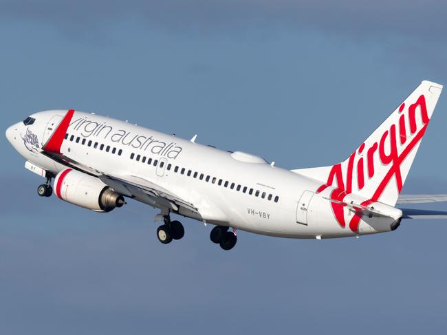 Sydney, Australia - October 7, 2013: Virgin Australia Airlines Boeing 737 airliner landing at Sydney Airport.