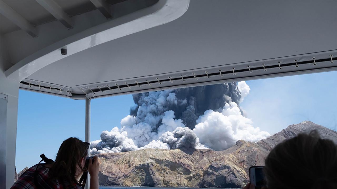 White Island spewing steam and ash moments after it erupted. Picture: AFP/ Michael Schade