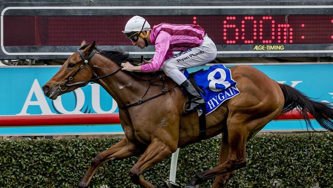 Race two at the Gold Coast Turf Club on Saturday. Winning horse Hacksaw Ridge (white cap, pink top), ridden by Ryan Plumb. Photo: Jerad Williams.