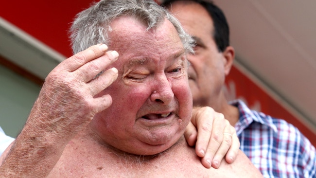 Flood victim Frank Beaumont shows emotion after listening to a live stream at Goodna, west of Brisbane. Friday, November 29, 2019.  (AAP Image/Jono Searle) 