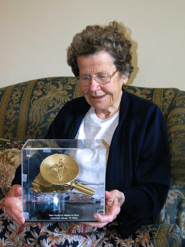 Venetia Burney, who suggested Pluto’s name in 1930, admires a model of the New Horizons spacecraft that was launched in 2006 with the primary mission to perform a fly-by study of the Pluto system in 2015. Picture: Martin George