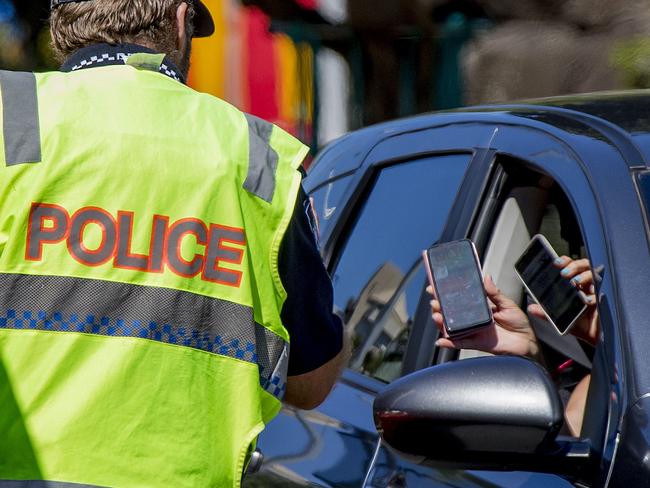 The Queensland Premier has announced changes to the  border restrictions and says that no more police will be needed to patrol the state's borders with New South Wales. Police at the Griffith St, Coolangatta, border site . Picture: Jerad Williams