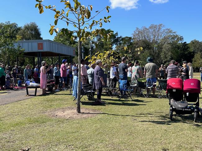 Members of the Oasis Church gathered at Kershaw Gardens, Rockhampton, after a fire destroyed their church overnight.