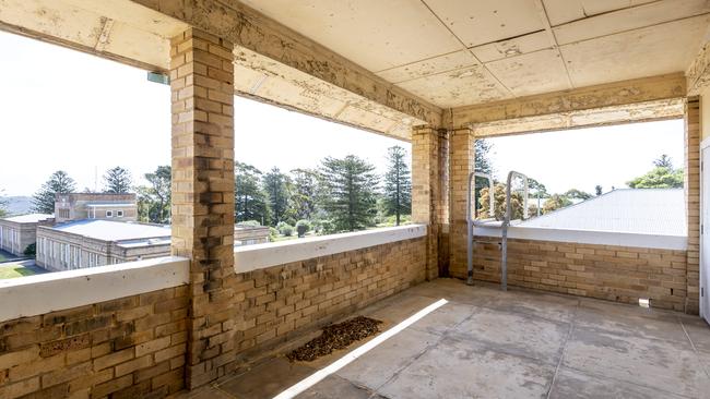 Upstairs on the outside corridor where the dormitory rooms are situated. The building offers great views across the parade ground and across the harbour. Picture: NCA NewsWire/ Monique Harmer