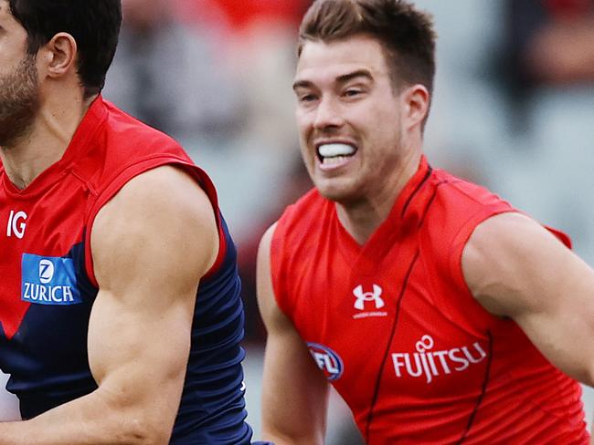 MELBOURNE . 15/04/2023.  AFL . Round 5. Gather Round.  Essendon vs Melbourne at the Adelaide Oval.  Christian Petracca of the Demons  charges out of the middle in front of Zach Merrett of the Bombers   . Pic: Michael Klein