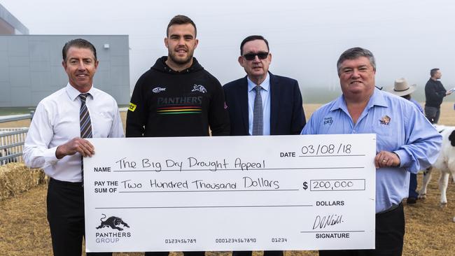 Penrith Panthers representatives Greg Alexander, Kaide Ellis and Brian Fletcher with Rural Aid CEO and Buy A Bale founder Charles Alder. Picture: Penrith Panthers