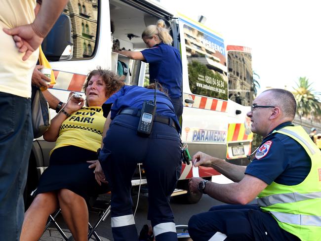 A taxi protester is treated by paramedics at Parliament. Picture: Nicole Garmston