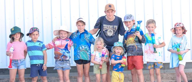 Sienna McCarthy, 7, Cohen West, 6, Charlotte Cormack, 7, Skylar McCarthy, 9, Hannah Holzfeind, 8, Aleah West, 13, Isaac Cormack, 2, Lucas Cormack, 8, Jai Holzfeind, 8, and Elsie Buchanan, 7, enjoying day one of the Royal Darwin Show. Picture: Glenn Campbell