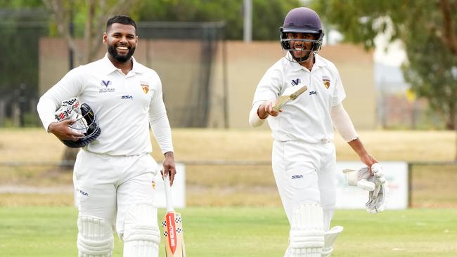 Thaveesh Attanayake and Jonathan Vincent walk off after a Kingston Hawthorn victory. Picture: George Sal