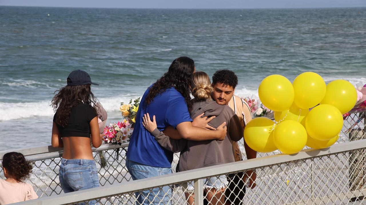 Vigil on Woorim beach for shark attack victim Teenage girl Charlize Zmuda, killed in shark attack late Monday afternoon - Flowers increase at the site of the shark attack. Picture: David Clark