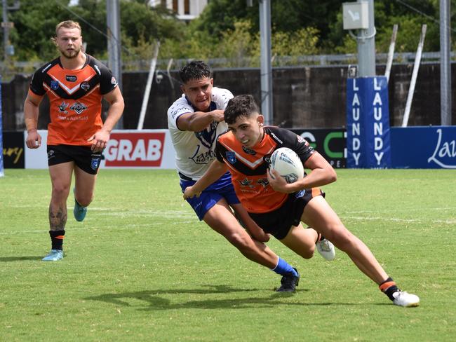 Levi Conti is tackled by Kallum Weatherall-Stacey. Picture: Sean Teuma/NewsLocal