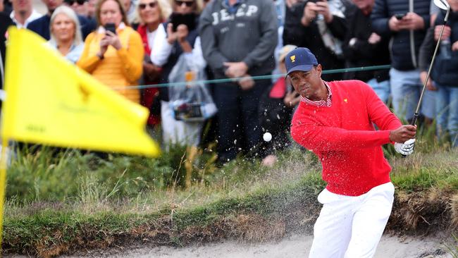 Tiger Woods hits out of the bunker. Picture: Michael Klein