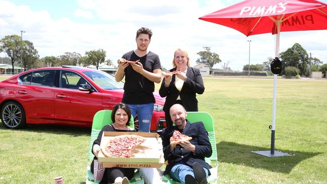 Sydney Hills Outdoor Cinema’s Michael Watson and Hills Shire Mayor Michelle Byrne with SmoothFM radio hosts Bogart Torelli and Glenn Daniel enjoy an Epic Pizza ahead of the Sydney Hills Outdoor Cinema. Infiniti Cars Castle Hill will have drive-in experiences up for grabs as a lucky door prize.