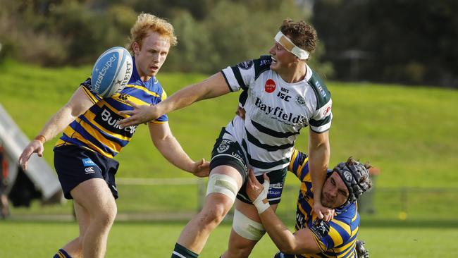 Sydney University (stripes) playing Warringah in round one of the Shute Shield. Pic: Karen Watson.