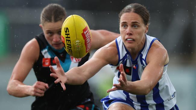 MELBOURNE, AUSTRALIA - SEPTEMBER 20: Jasmine Garner of the Kangaroos contests the ball under pressure from Abbey Dowrick of the Power during the round four AFLW match between North Melbourne Kangaroos and Port Adelaide Power at Mission Whitten Oval, on September 20, 2024, in Melbourne, Australia. (Photo by Daniel Pockett/AFL Photos/via Getty Images)