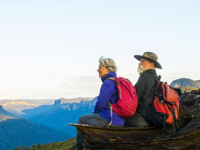 A senior couple hiking in the Australia outback. Blue Mountains National Park.