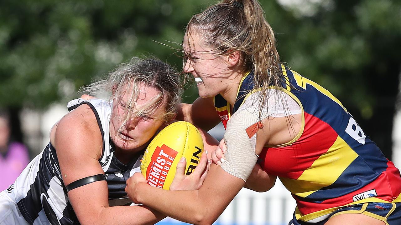 Madison Newman and Charlotte Taylor fight for the slippery ball. Picture: Sarah Reed/AFL Photos via Getty Images