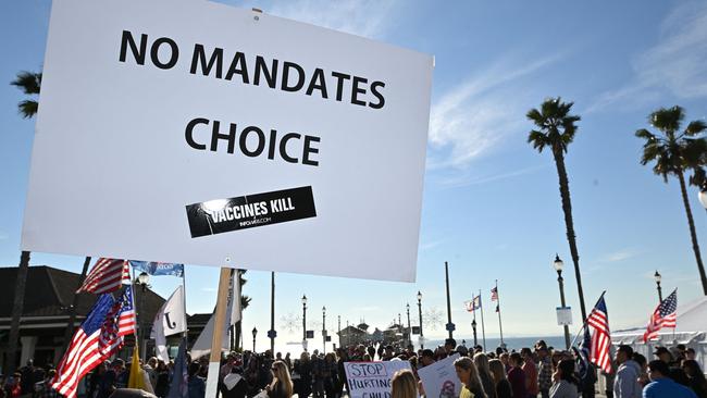 People demonstrate against Covid-19 vaccine mandates for students in Huntington Beach, California on January 3, 2022. - The Los Angeles Unified School District (LAUSD) announced in mid-December itâs decision to delay until fall 2022 its Covid-19 vaccine mandate for students 12 and older who attend class in person.  The original deadline for in-person students to show proof of full vaccination was January 10, 2022. (Photo by Robyn Beck / AFP)