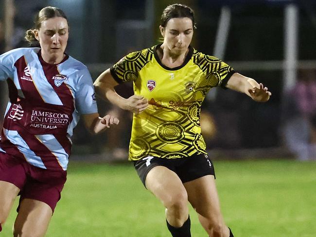 Strikers' Astia Neckebroeck and Tigers' Shelley Macaulay contest the ball in the Football Queensland Premier League (FQPL) Far North and Gulf women's grand final match between the Edge Hill Tigers and the Redlynch Strikers, held at Endeavour Park, Manunda. Picture: Brendan Radke