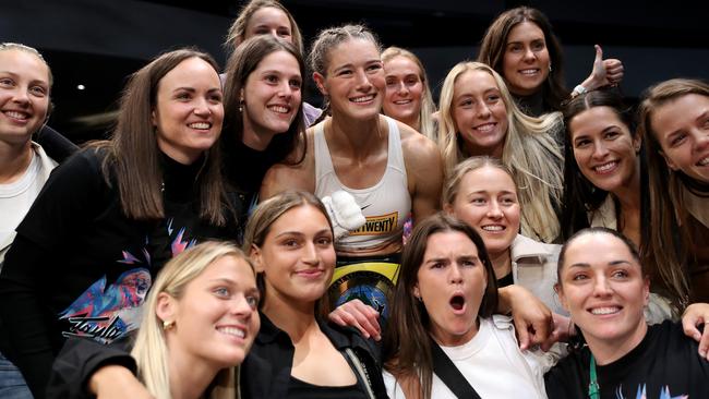 Tayla Harris celebrates victory with Melbourne Demon AFLW team mates. Photo by Kelly Defina/Getty Images.