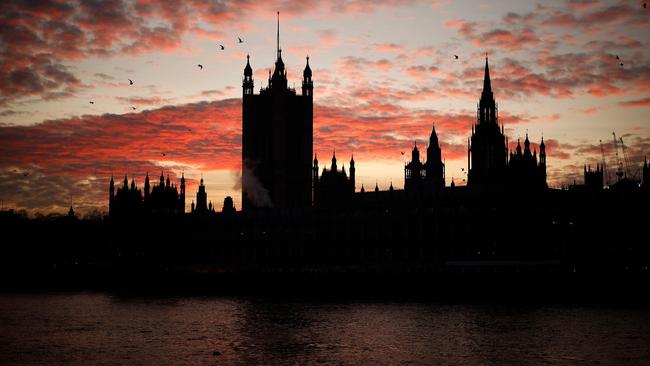 The sun sets behind the Victoria Tower at the Palace of Westminster, home to the Houses of Parliament, in London this month. Picture: AFP