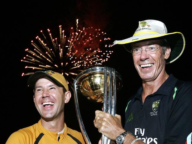 Aust cricket team captain Ricky Ponting, (L) and team coach John Buchanan, (R) celebrate with the trophy after winning the Cricket World Cup final against Sri Lanka at the Kensington Oval in Bridgetown, Barbados, Apr 28, 2007. laughing sport o/seas trophy fireworks in b/g