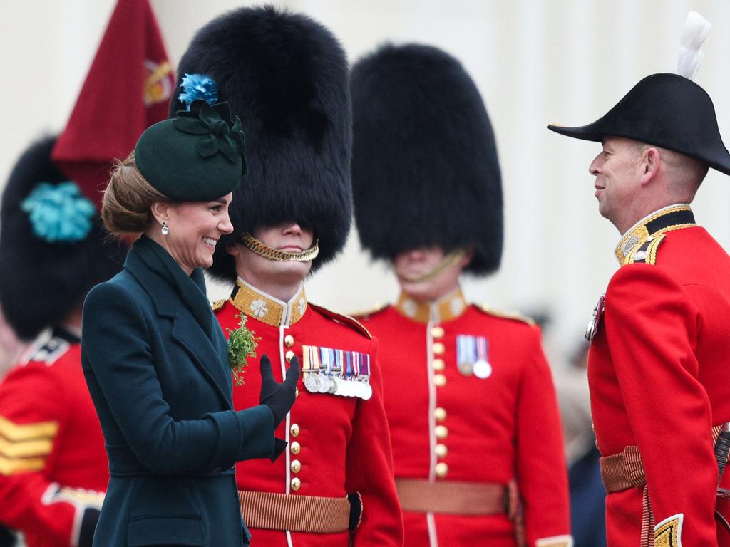 The Princess pins a sprig of gifted shamrock to her brooch. Picture: AFP
