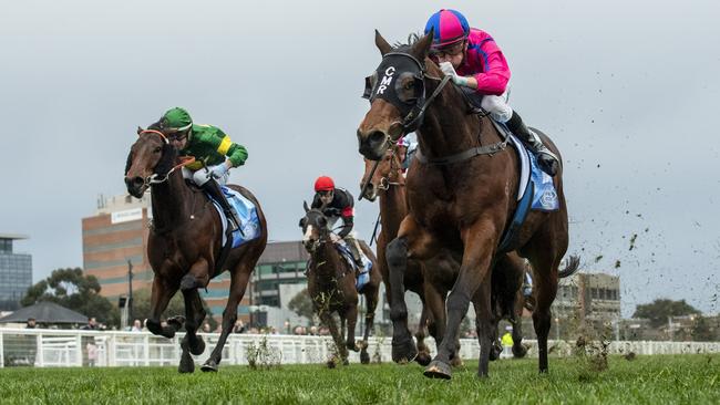 Recommendation (right) winning the Bletchingly Stakes at Caulfield on a track which has been impacted by wet weather. Picture: Vince Caligiuri/Getty Images