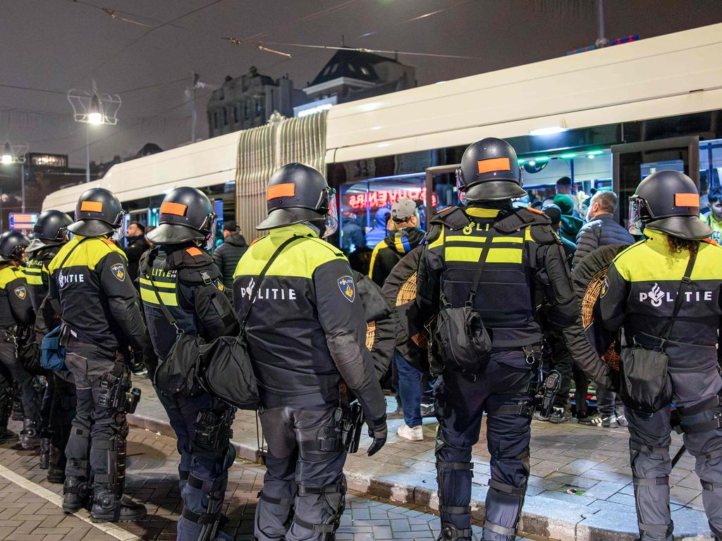 Dutch mobile Police officers stand guard after several scuffles broke out in the city center following the UEFA Europa League, League phase - Matchday 4, football match between Ajax Amsterdam and Maccabi Tel Aviv, in Amsterdam on November 8, 2024. Dutch Prime Minister Dick Schoof described âanti-Semitic attacks on Israelisâ in Amsterdam as âunacceptableâ, in a message posted on his X account. (Photo by VLN Niews / ANP / AFP) / Netherlands OUT